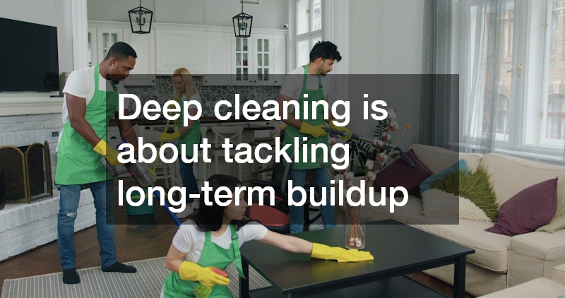 team of cleaners working together in a living room