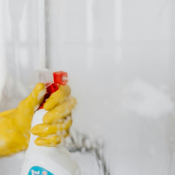 spray bottle aimed at bathroom wall