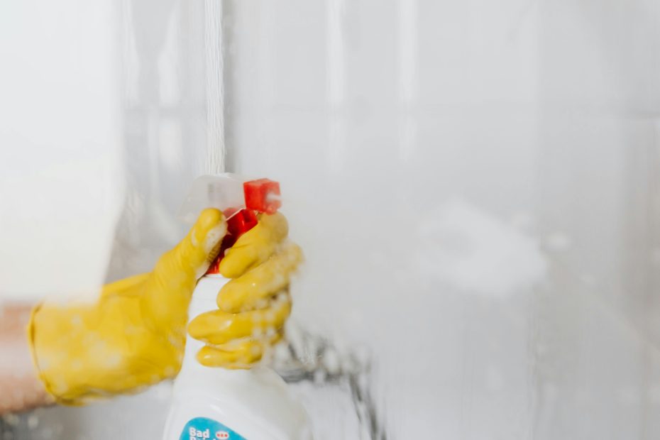 spray bottle aimed at bathroom wall